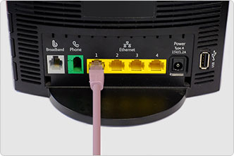 Ethernet cable plugged into back of router.